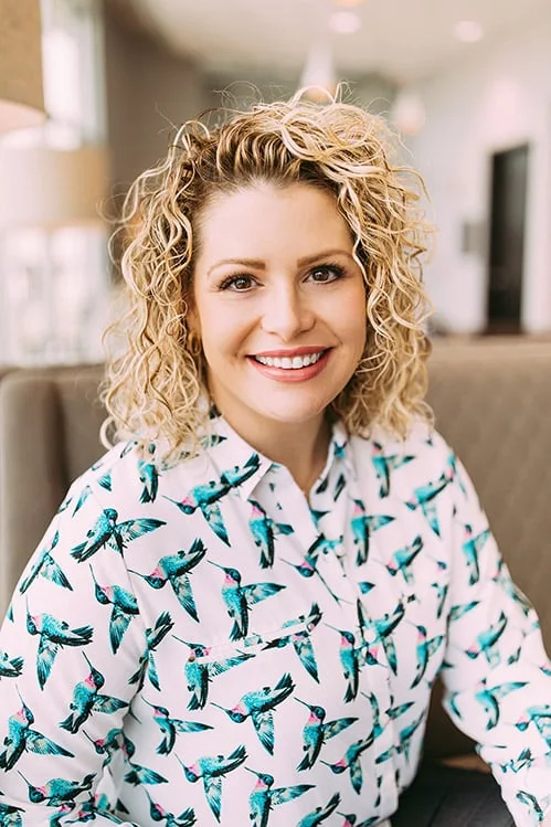Dr. Lisa Bearden, smiling, in a patterned blouse